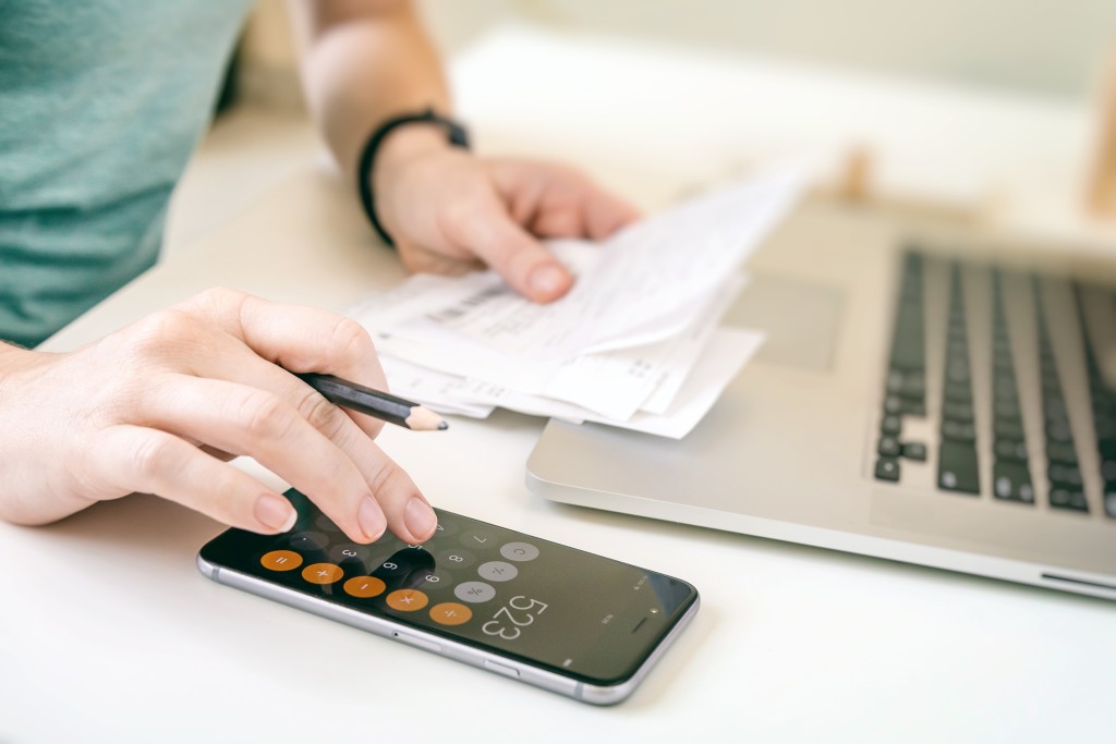 woman-making-audit-of-household-spendings-at-home-account-accountant-analysis-analyzing-annual-audit_t20_A9EwE6 (1)